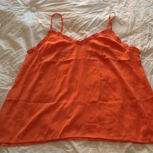 Orange top with ruffle trim